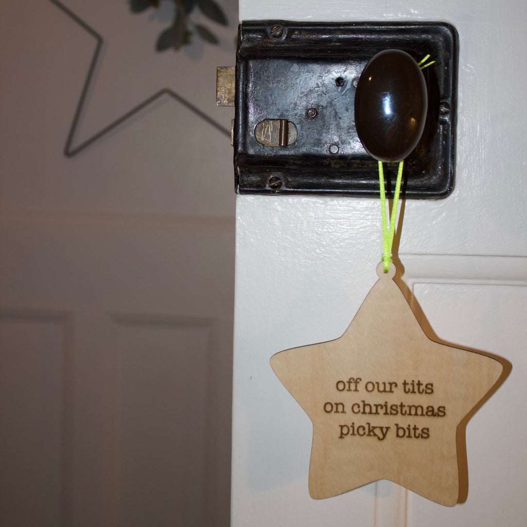 'Off our tits on christmas picky bits' Hanging Wooden Christmas Star Sign