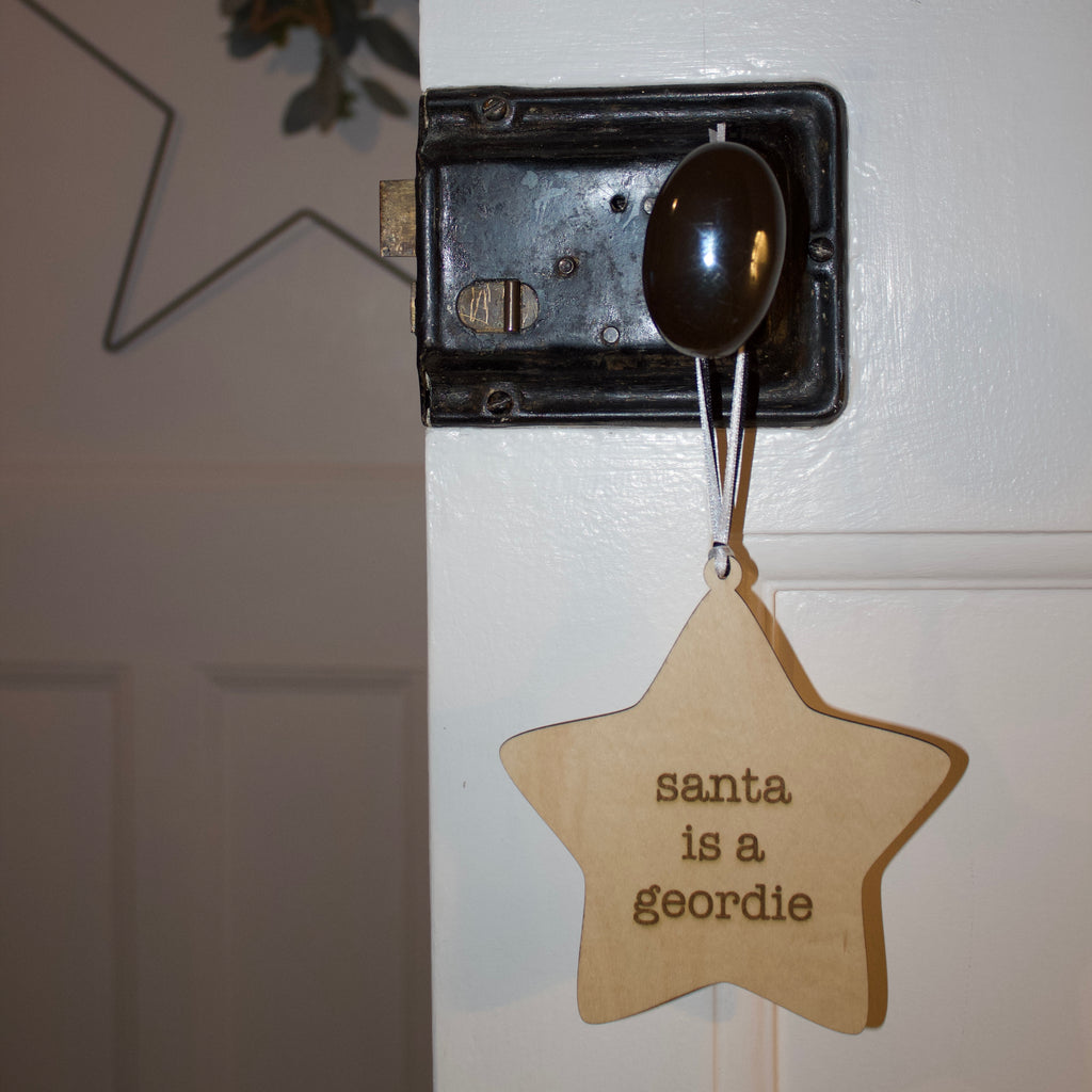'Santa is a Geordie' Hanging Wooden Geordie Christmas Star Sign